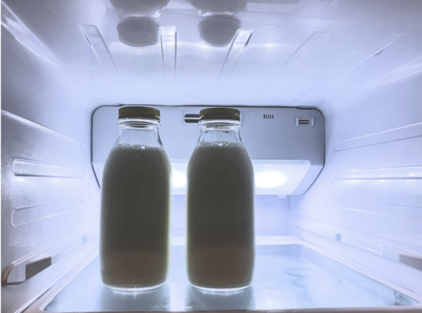 bottles of milk in a fridge