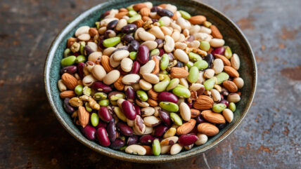 Bowl of protein-rich foods including kidney beans, peanuts, and more.