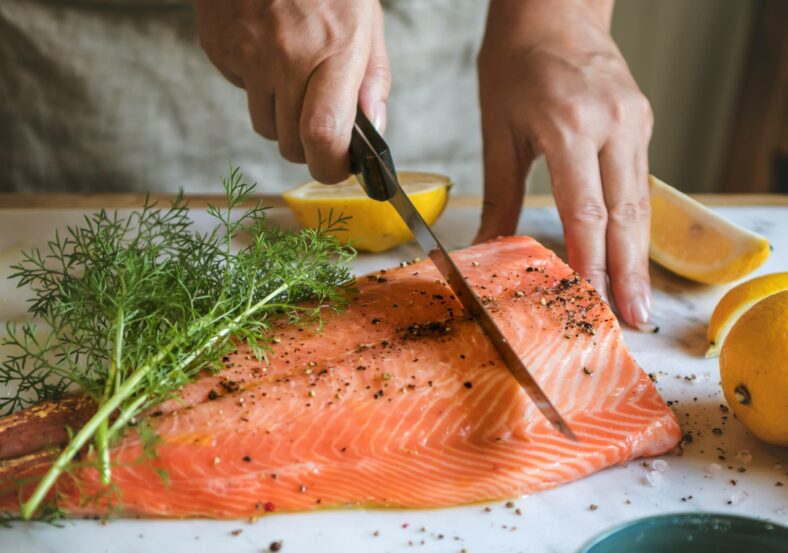 chef cutting salmon
