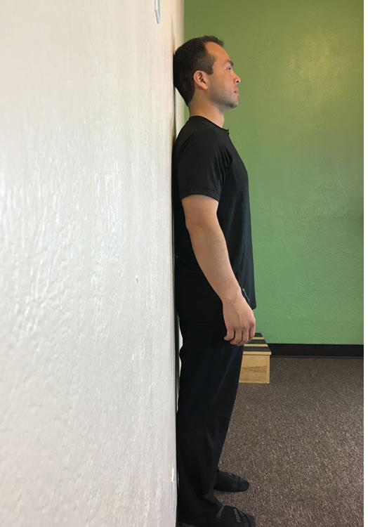 standing against the wall