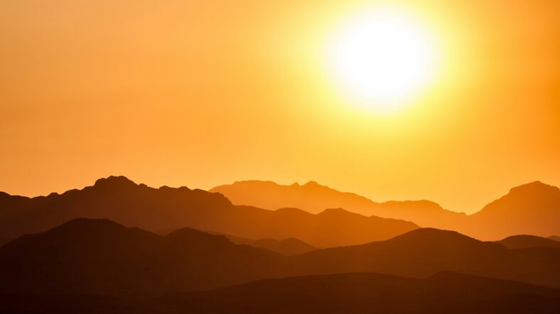 sun over mountains