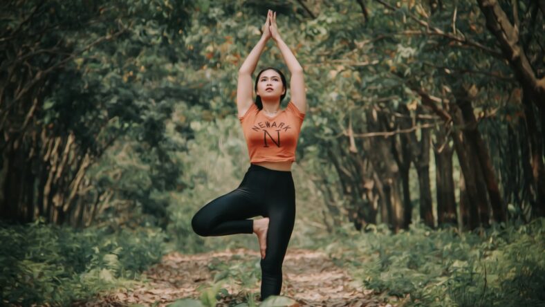 woman doing tree pose / balance exercises