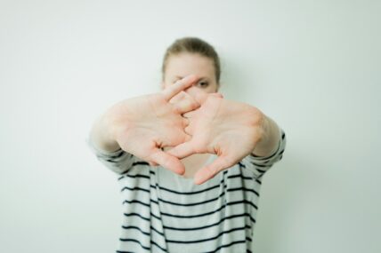 woman bending her fingers and wrists / foods that support joint health