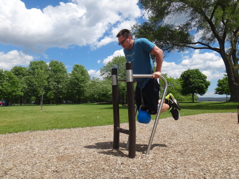man doing weighted dips