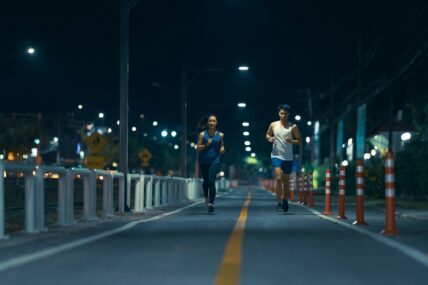 two people running at night / benefits of night running