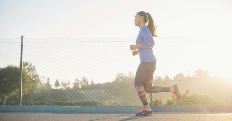 woman running on the road