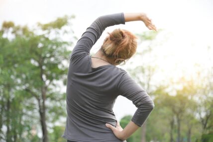 woman stretching / morning workouts