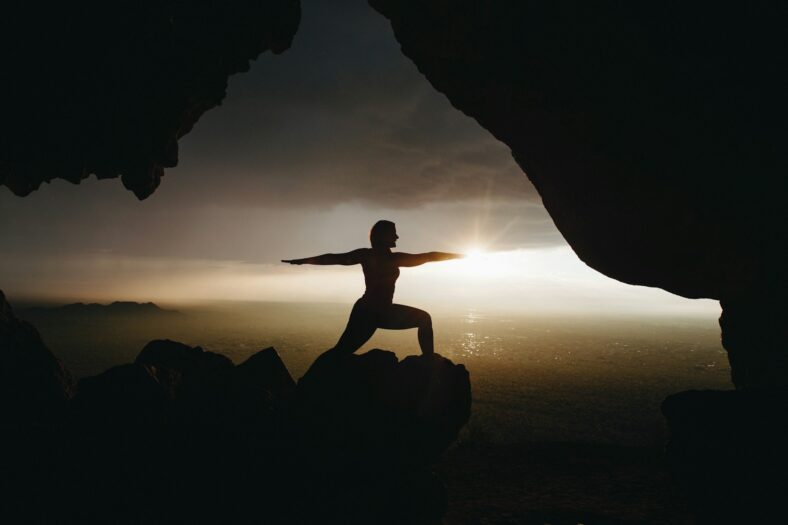 yoga pose in a cave