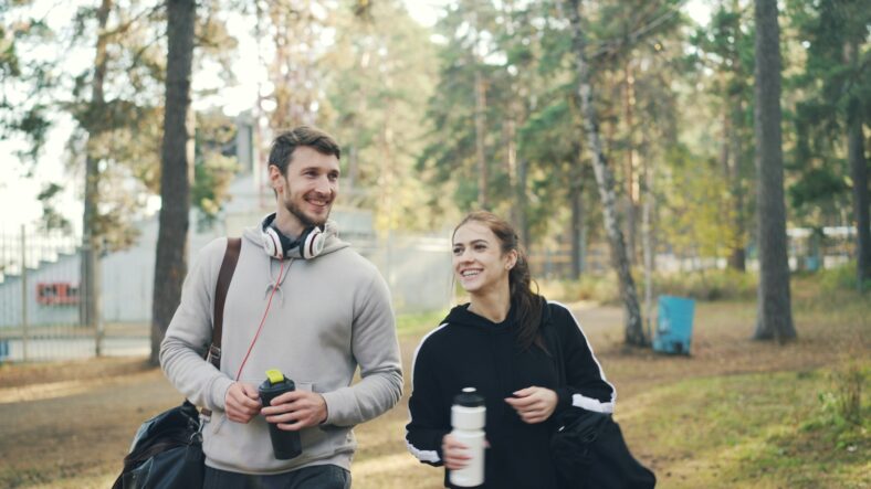 man and woman in workout gear