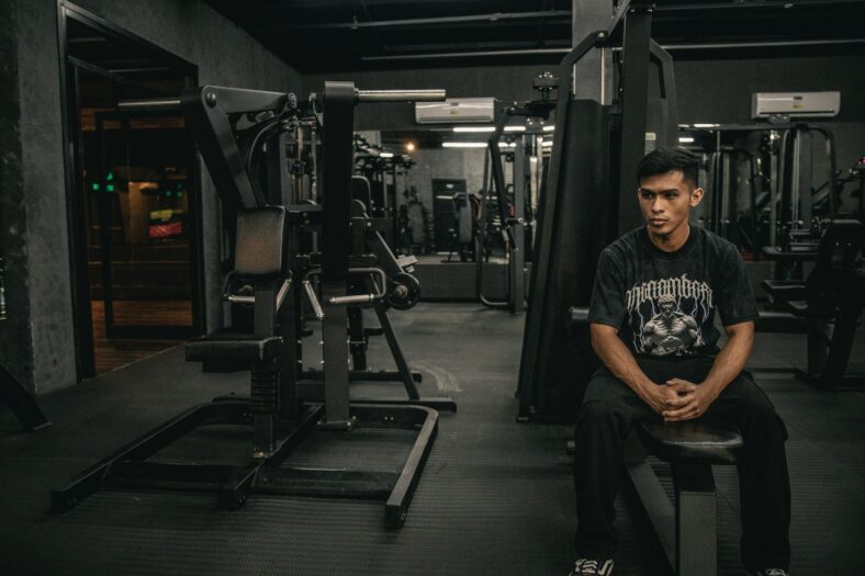 man sitting in a gym