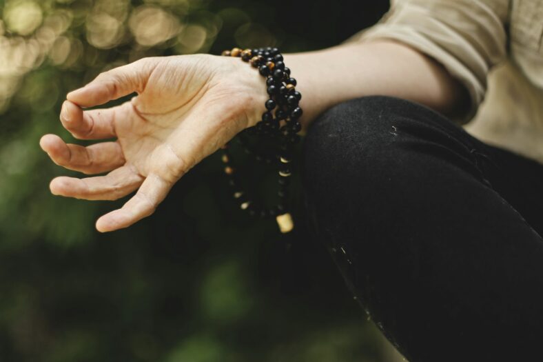 meditation beads on womans wrist