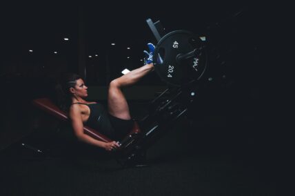 woman doing a leg press / leg workouts