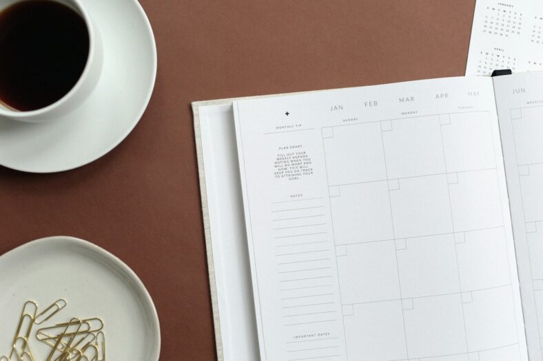 blank calendar next to coffee cup