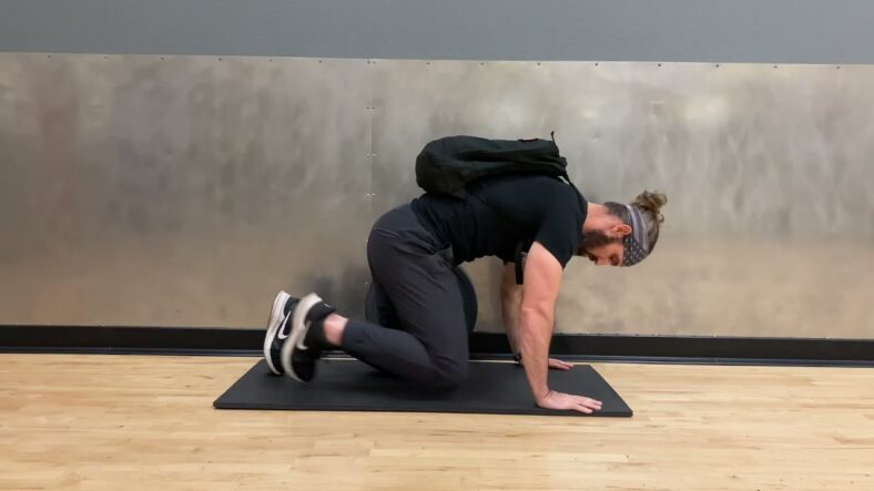 man doing weighted push up