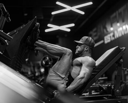 man using leg press machine