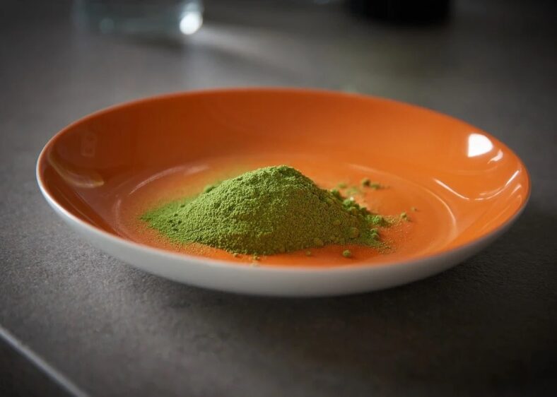 moringa powder on orange bowl
