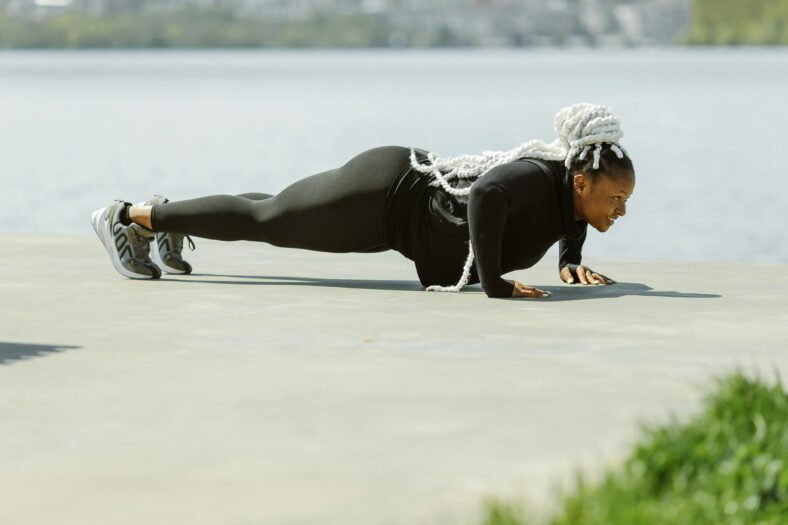 woman doing push up on the ground