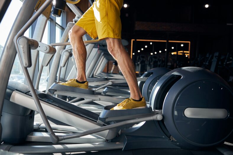 man using elliptical