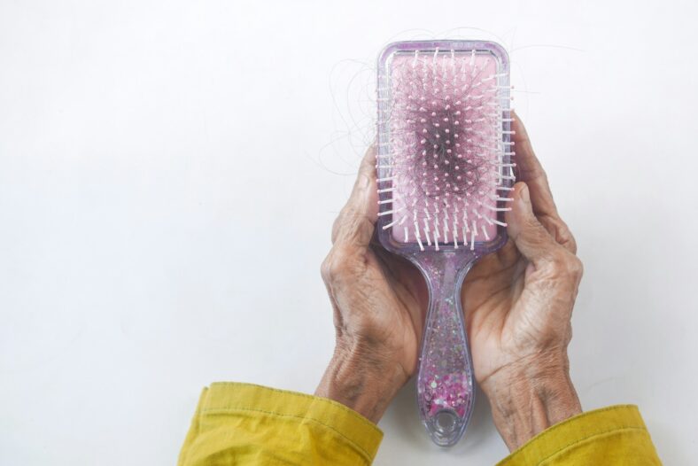 clump of hair in hairbrush
