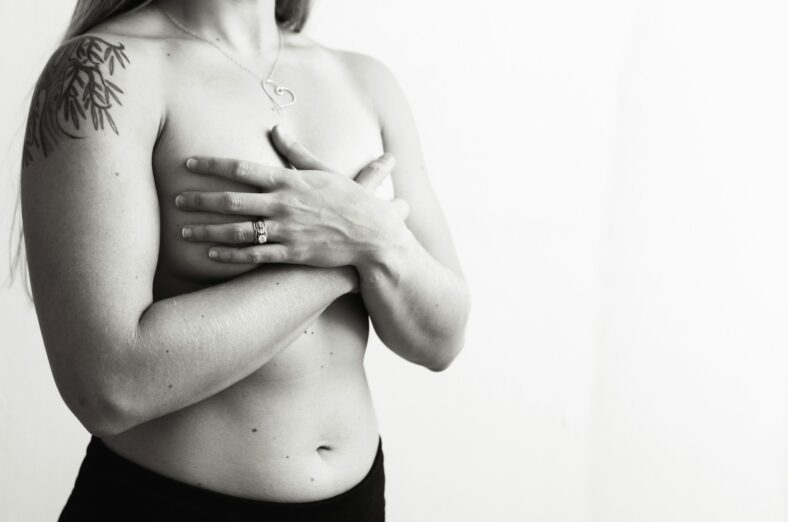 woman holding breasts